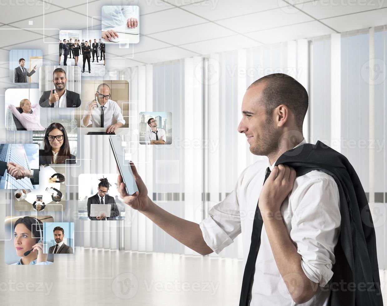 Businessman looks at his team photo