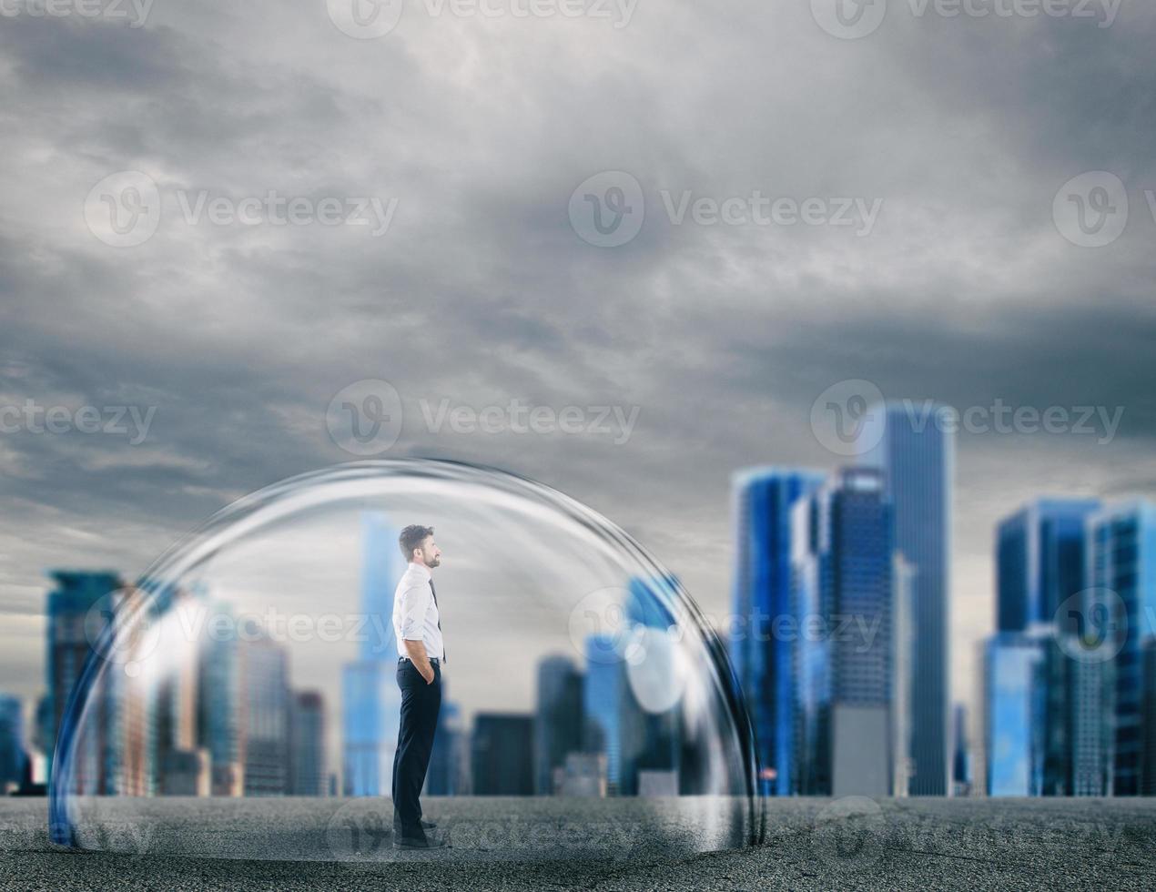 Businessman safely inside a shield dome. Protection and safety concept photo
