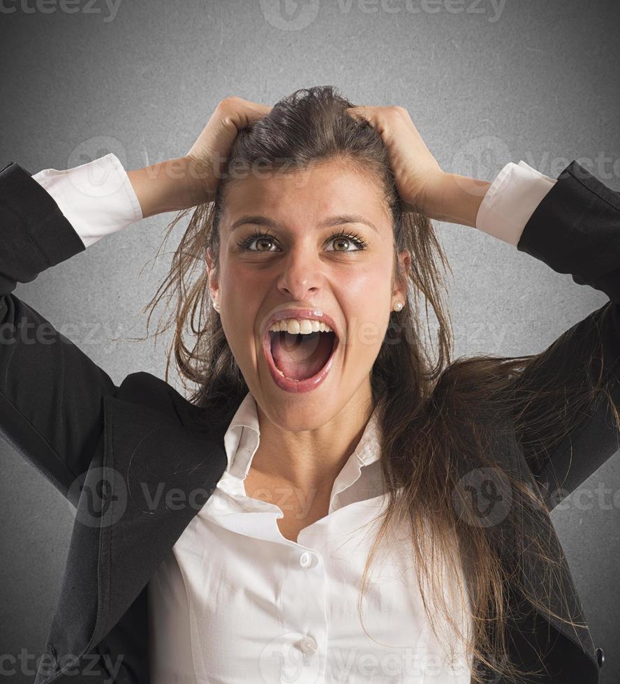Furious businesswoman screams photo