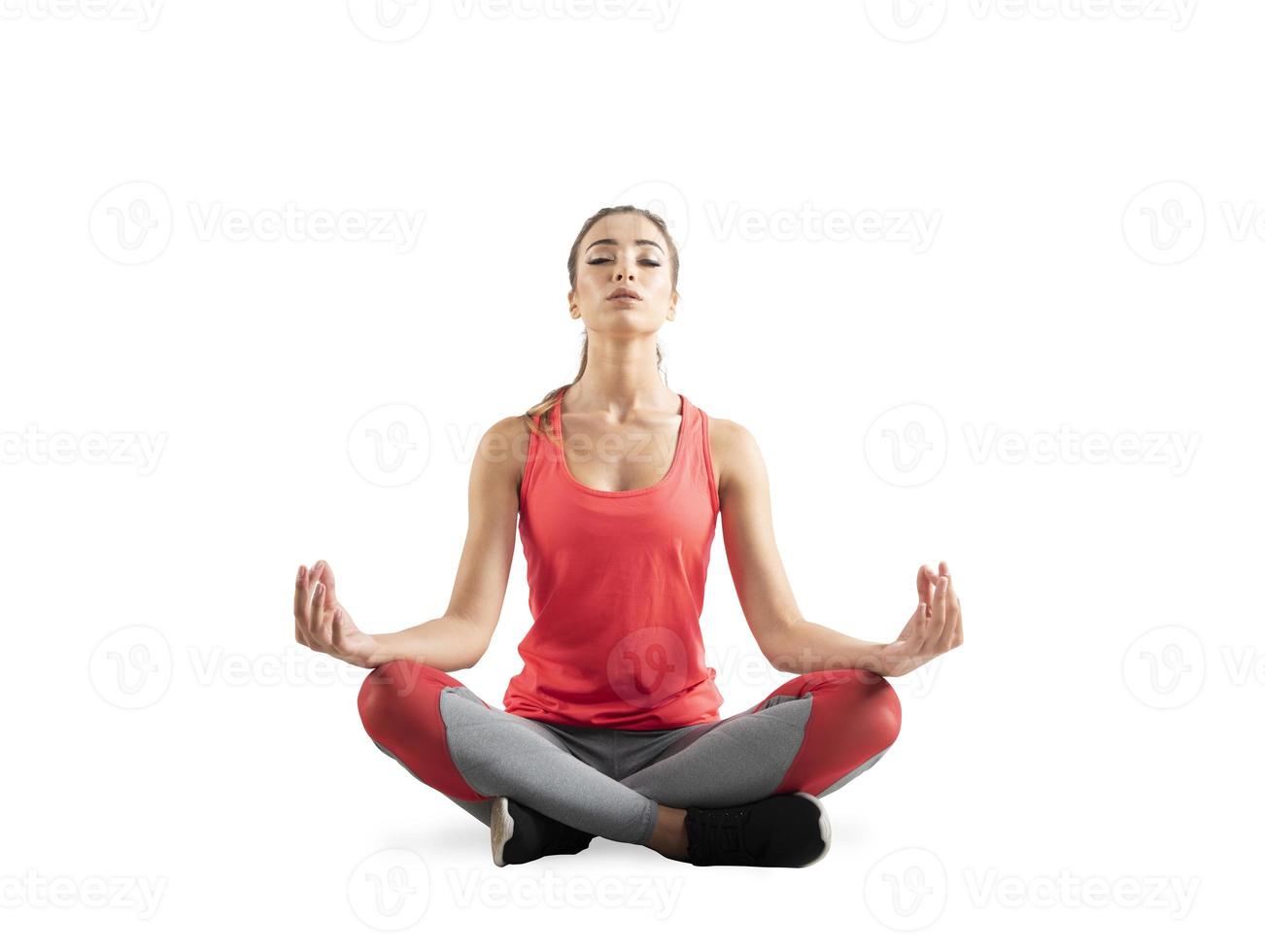 Young girl relaxing in yoga position. Isolated on white background photo