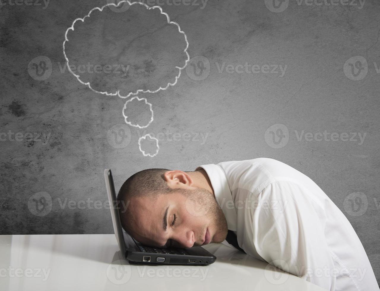 Businessman dreams while sleeping photo