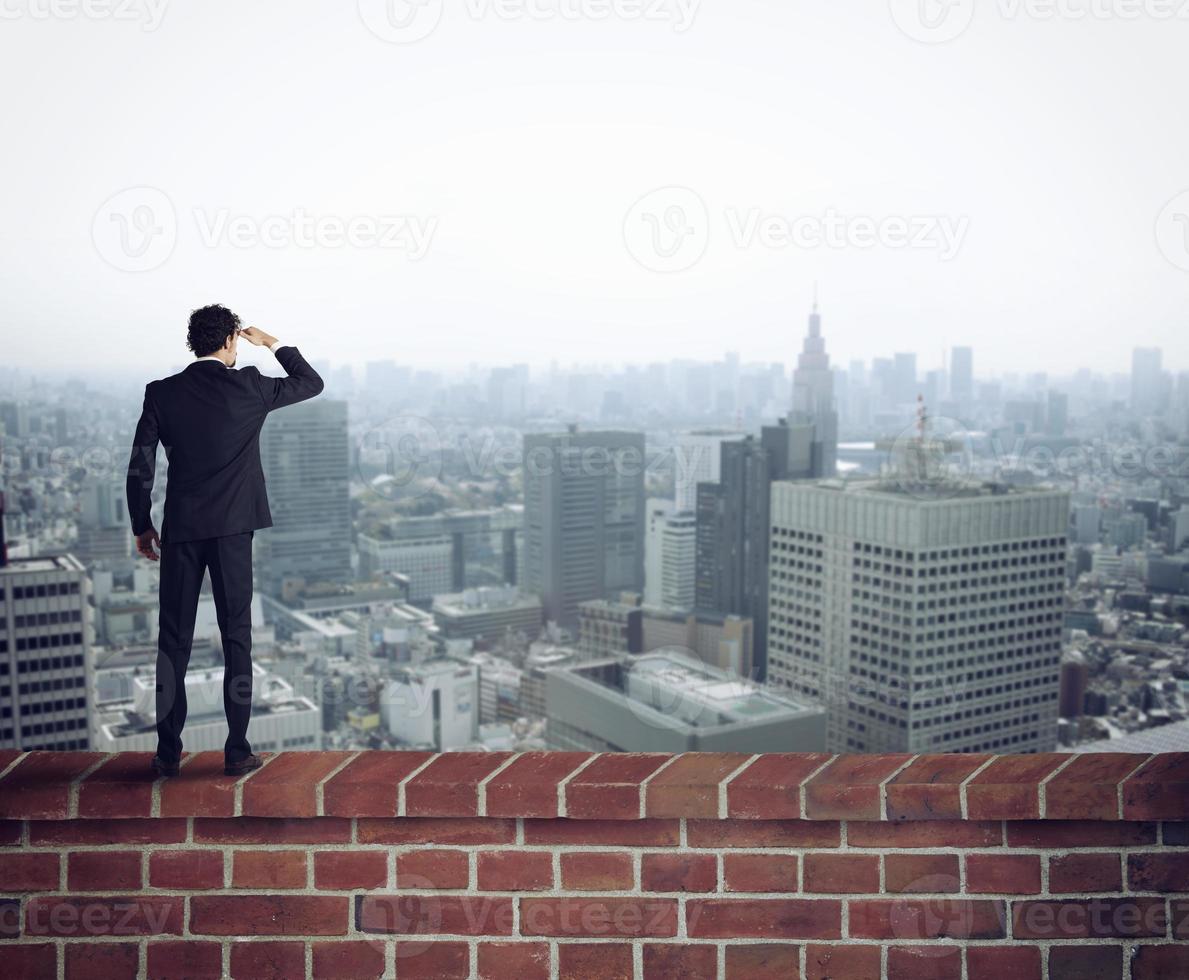 Businessman looks the future for new opportunities photo