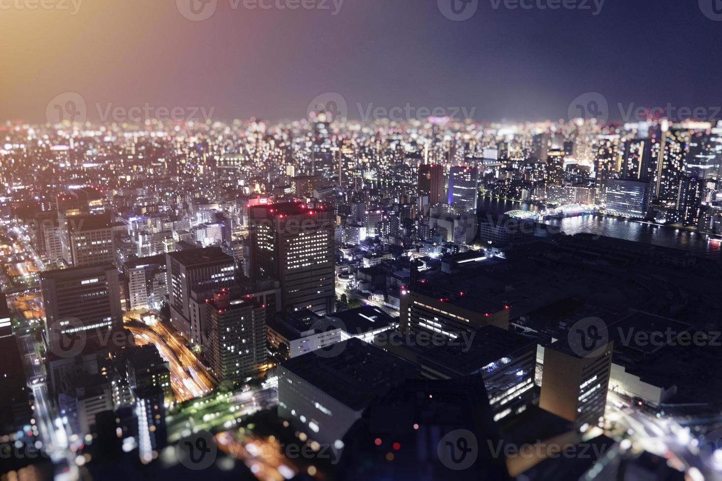 Night skyline of Tokyo city from a skyscraper. photo