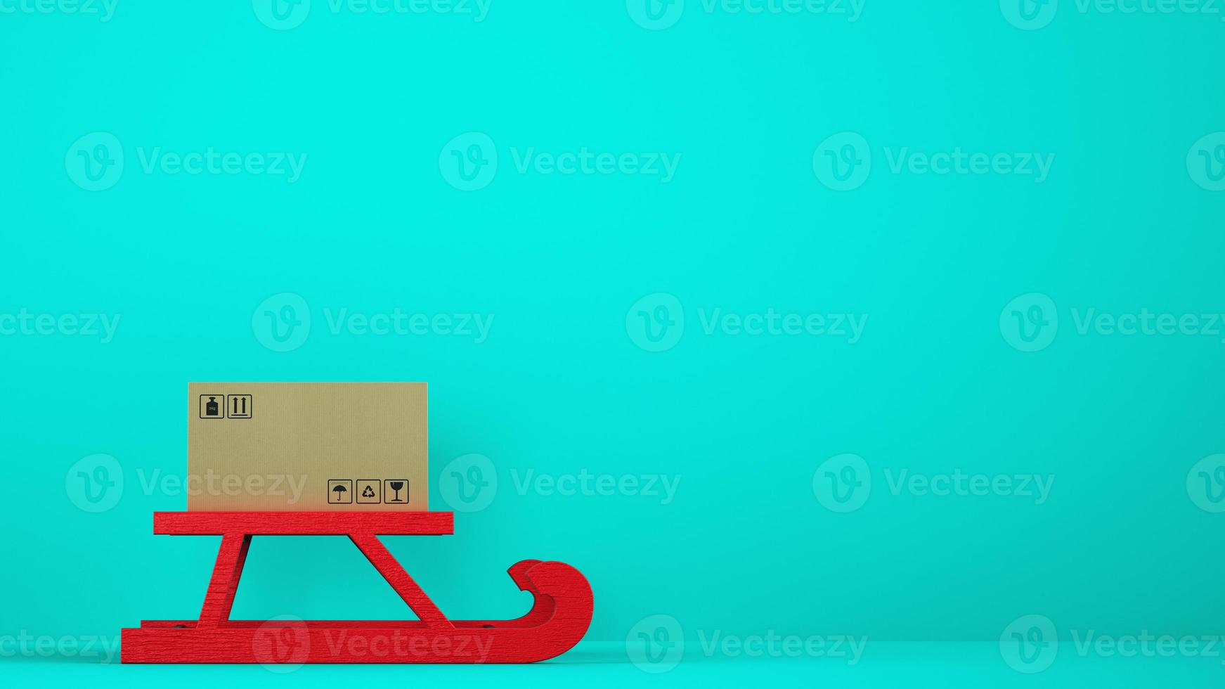 Cardboard box on red Christmas sleigh with cyan background photo