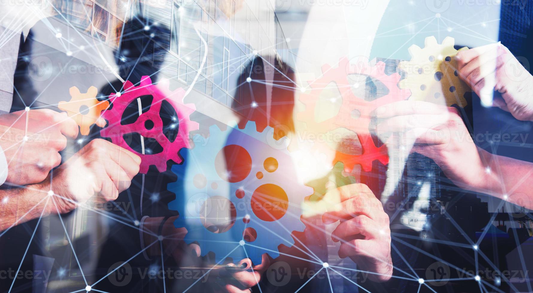 Business team connect pieces of gears. Teamwork, partnership and integration concept with network effect. double exposure photo