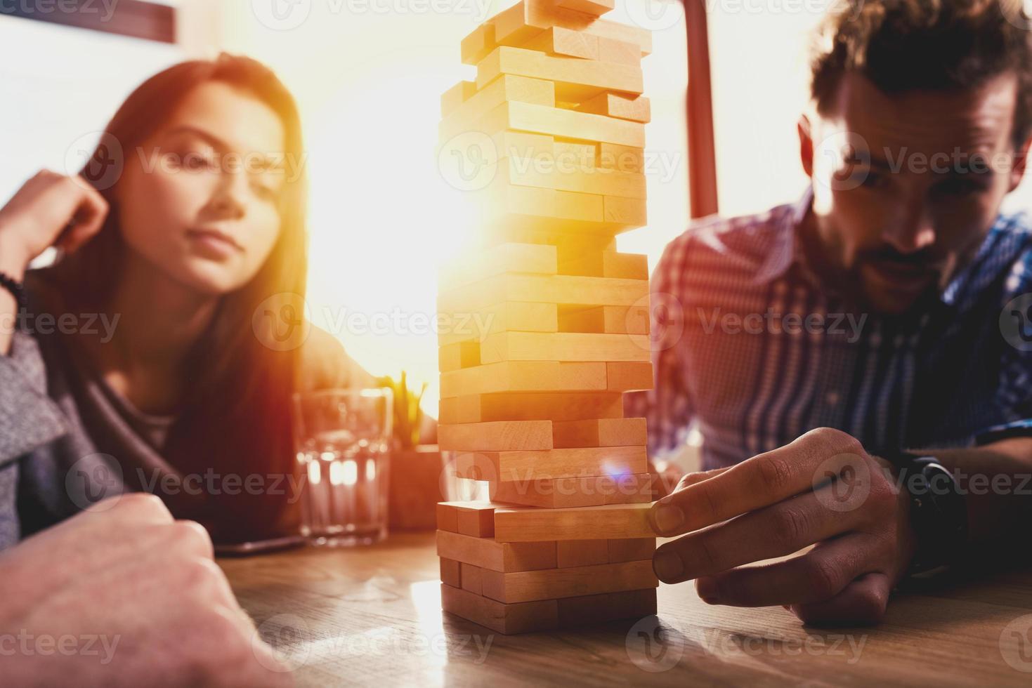 Team of business people build a wooden construction. concept of teamwork ,partnership and company startup photo
