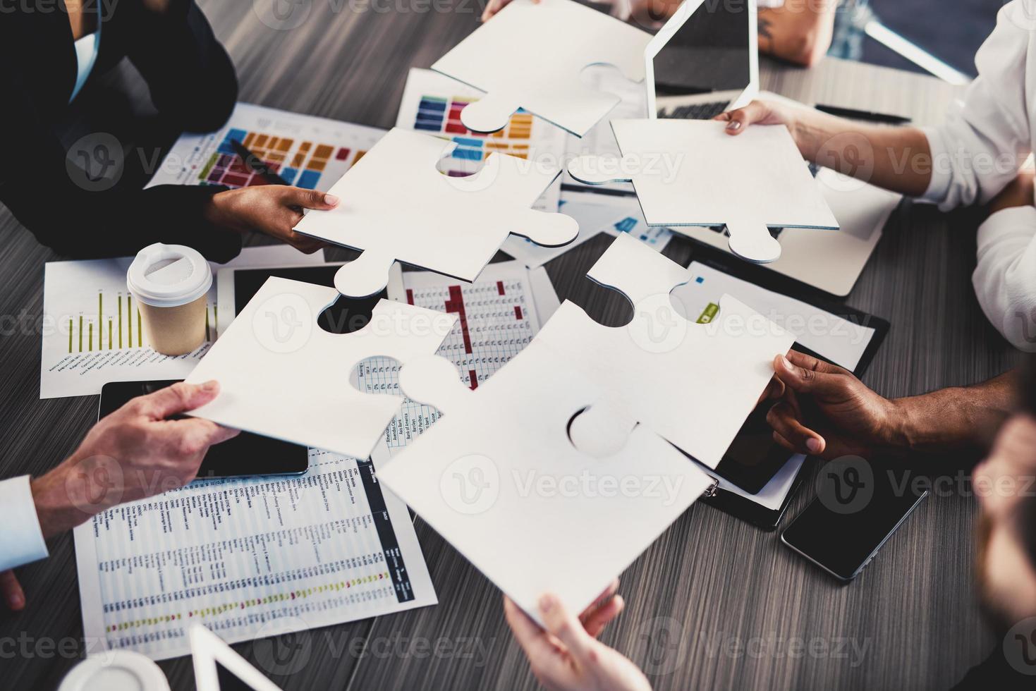 Teamwork of partners. Concept of integration and startup with puzzle pieces photo