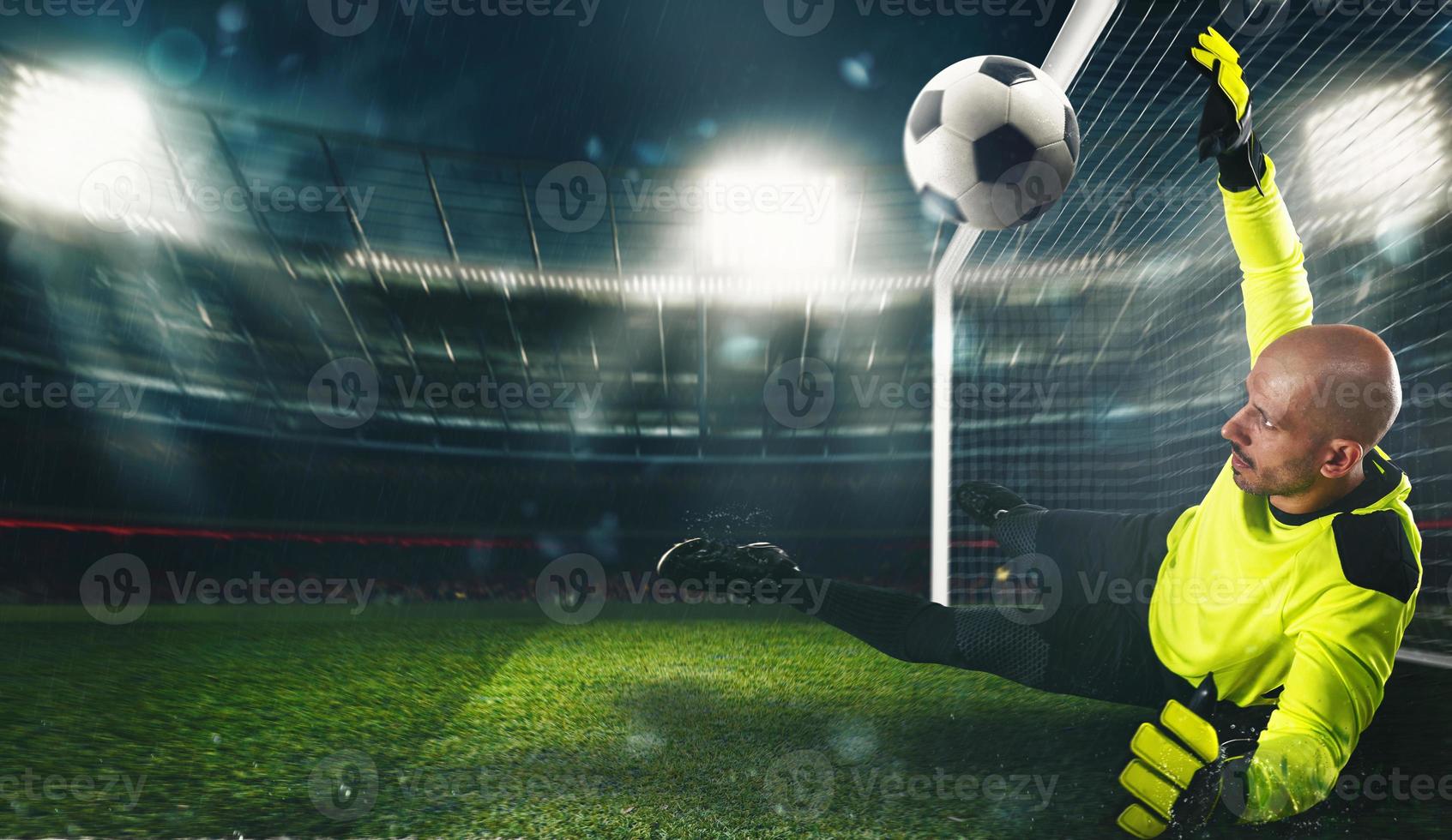 Soccer goalkeeper, in fluorescent uniform, that makes a great save and avoids a goal at the stadium photo