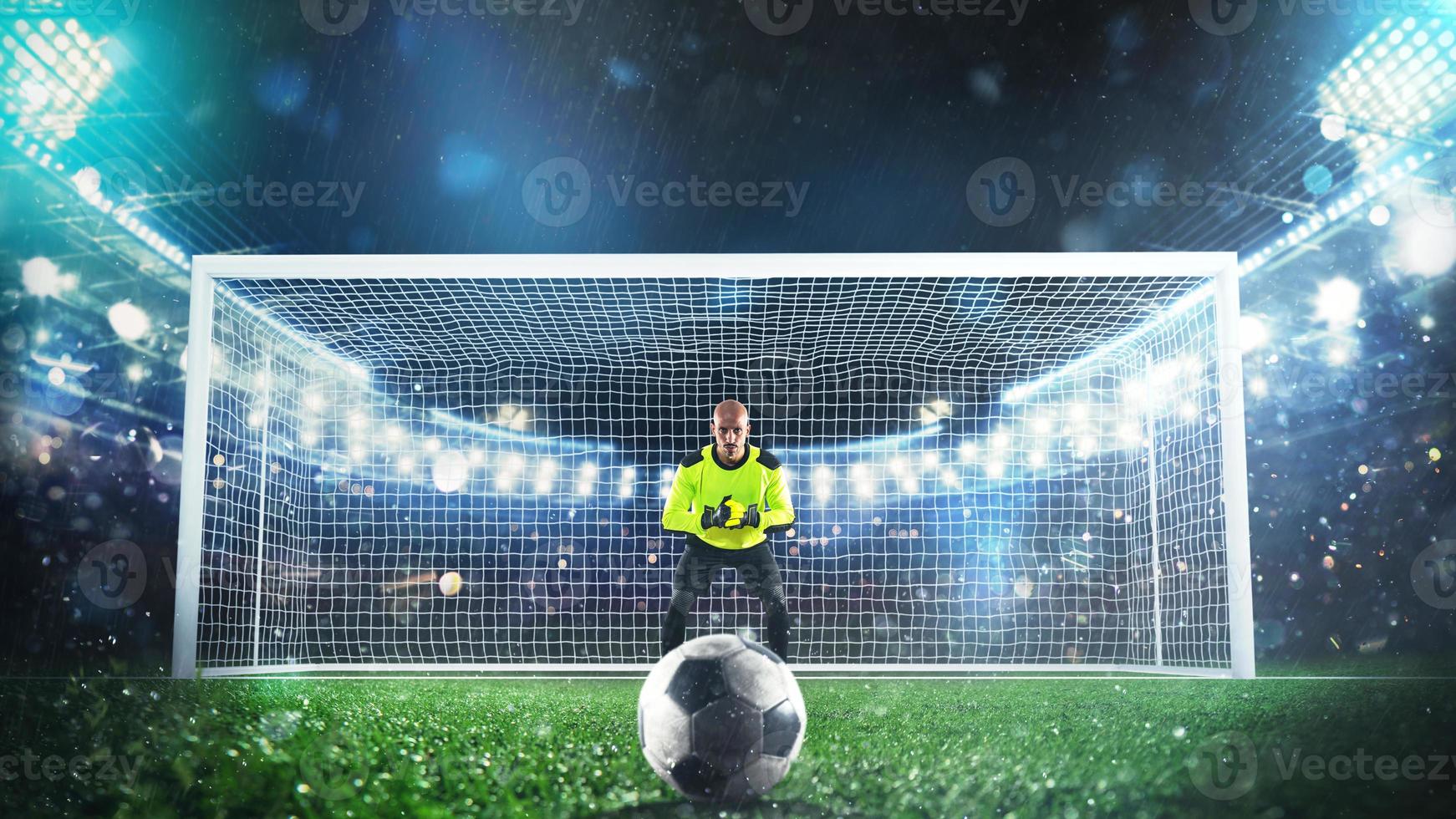 Soccer goalie ready to save a penalty kick at the stadium photo
