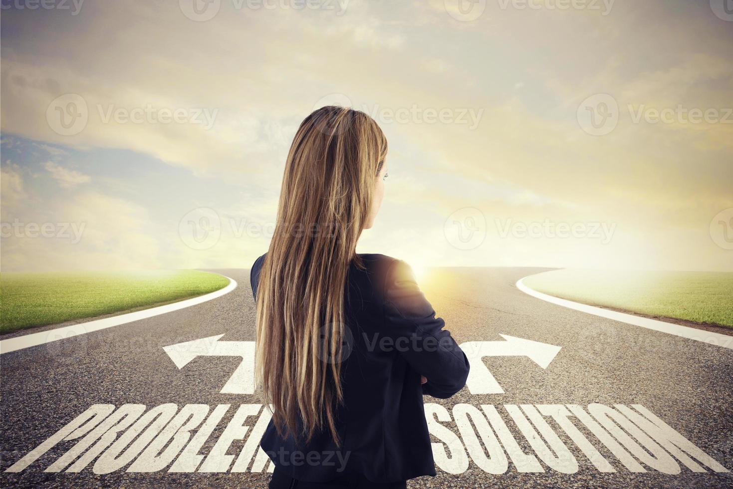 Businesswoman at a crossroads. She chooses the correct way. Concept of decision in business photo