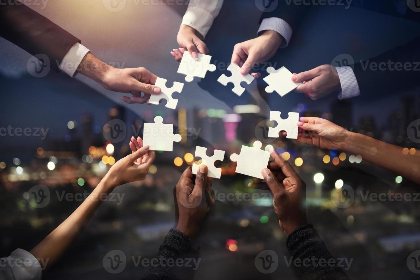 Teamwork of partners. Concept of integration and startup with puzzle pieces. Double exposure photo
