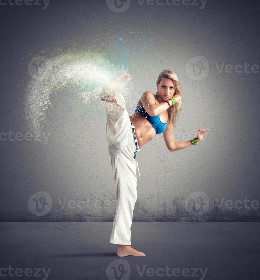 Woman playing capoeira photo