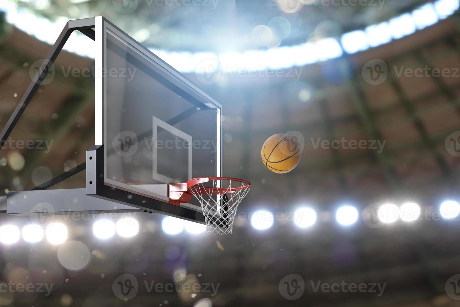 Basketball scene of a ball that is entering the basket photo