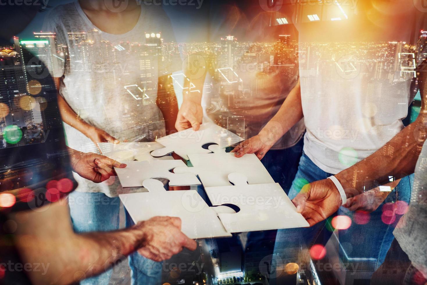 Teamwork of partners connect puzzle pieces as integration and startup photo