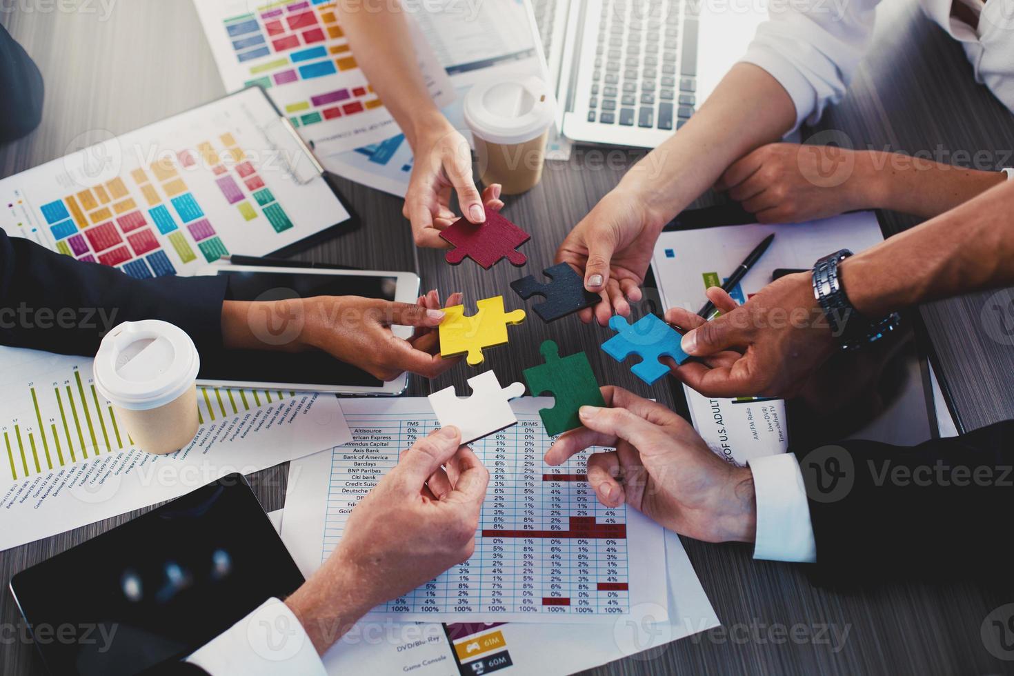 Teamwork of partners. Concept of integration and startup with puzzle pieces photo