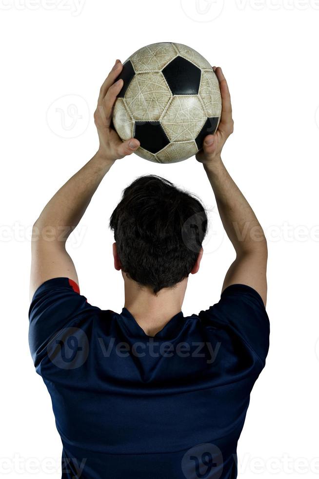 Close up of a football action scene with soccer player throws a soccerball photo