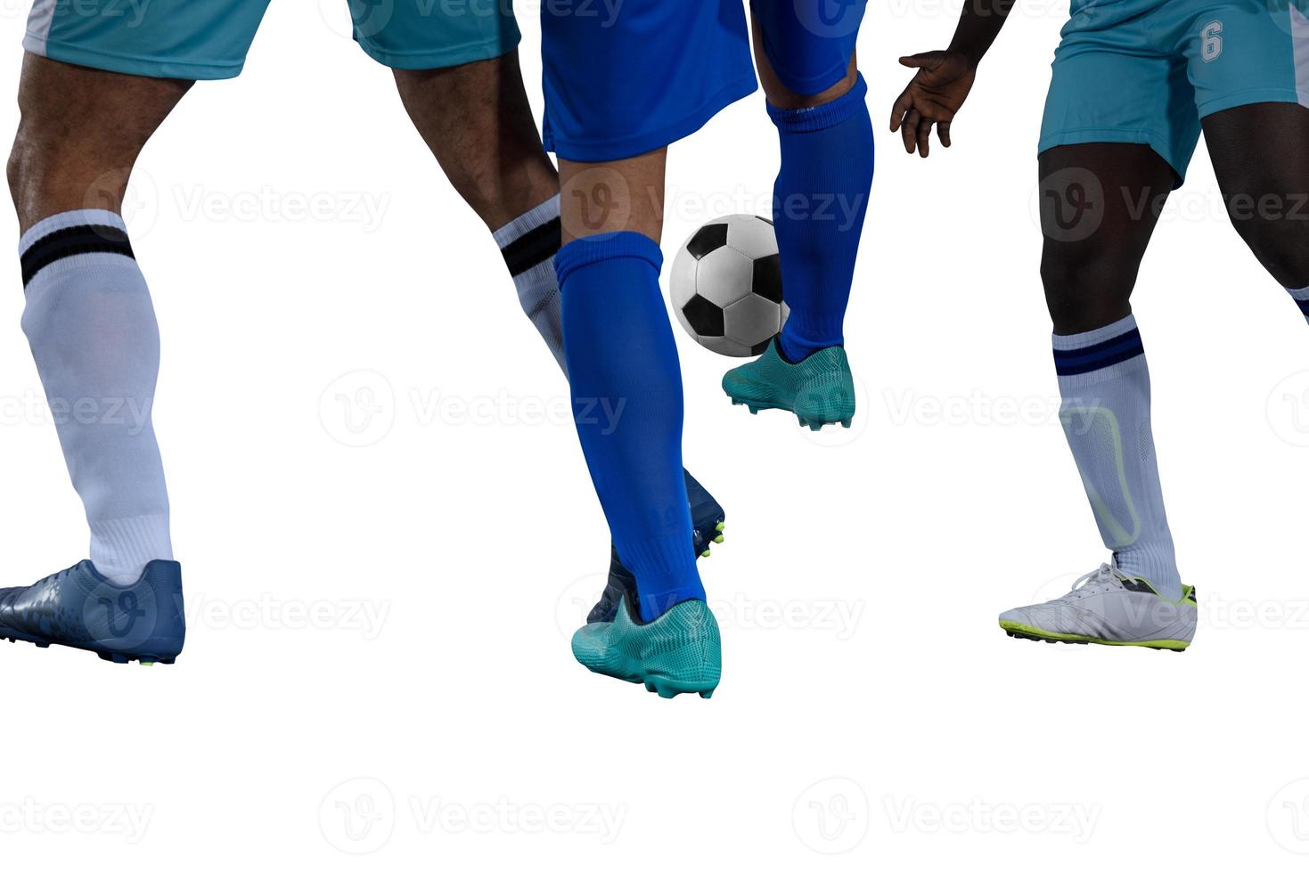 Isolated football player plays with soccerball in a match photo