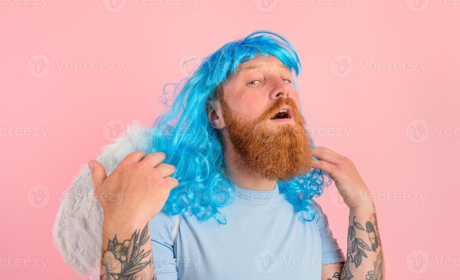 man with beard and blue peruke acts like an agel with wings photo