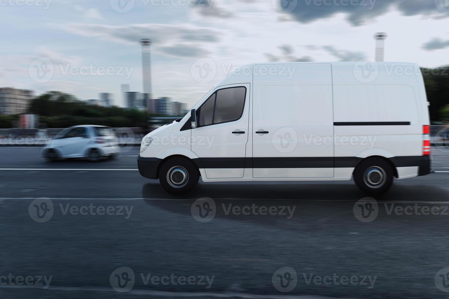 Transportation service with a white van moving fast on the road photo