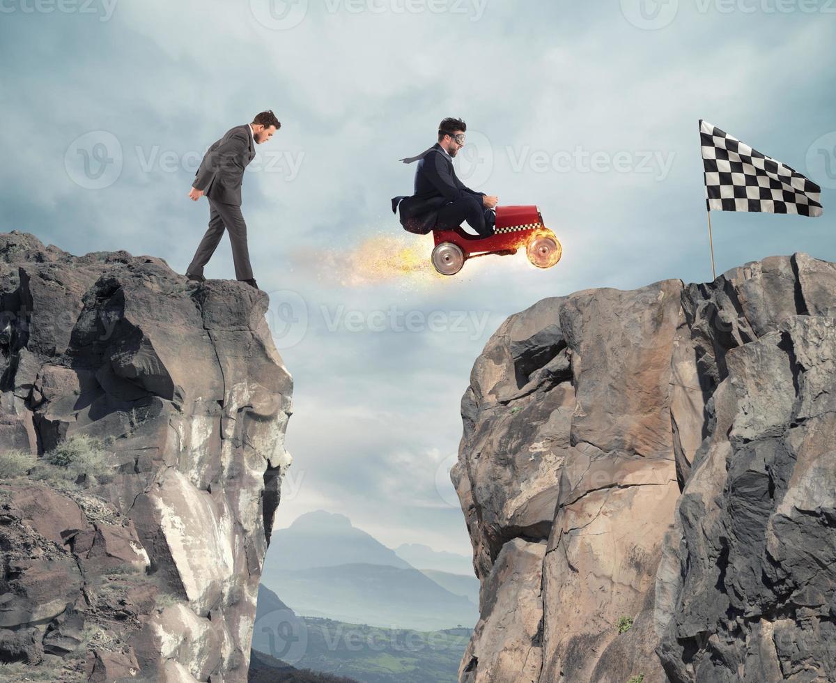 Fast businessman with a car wins against the competitors. Concept of success and competition photo
