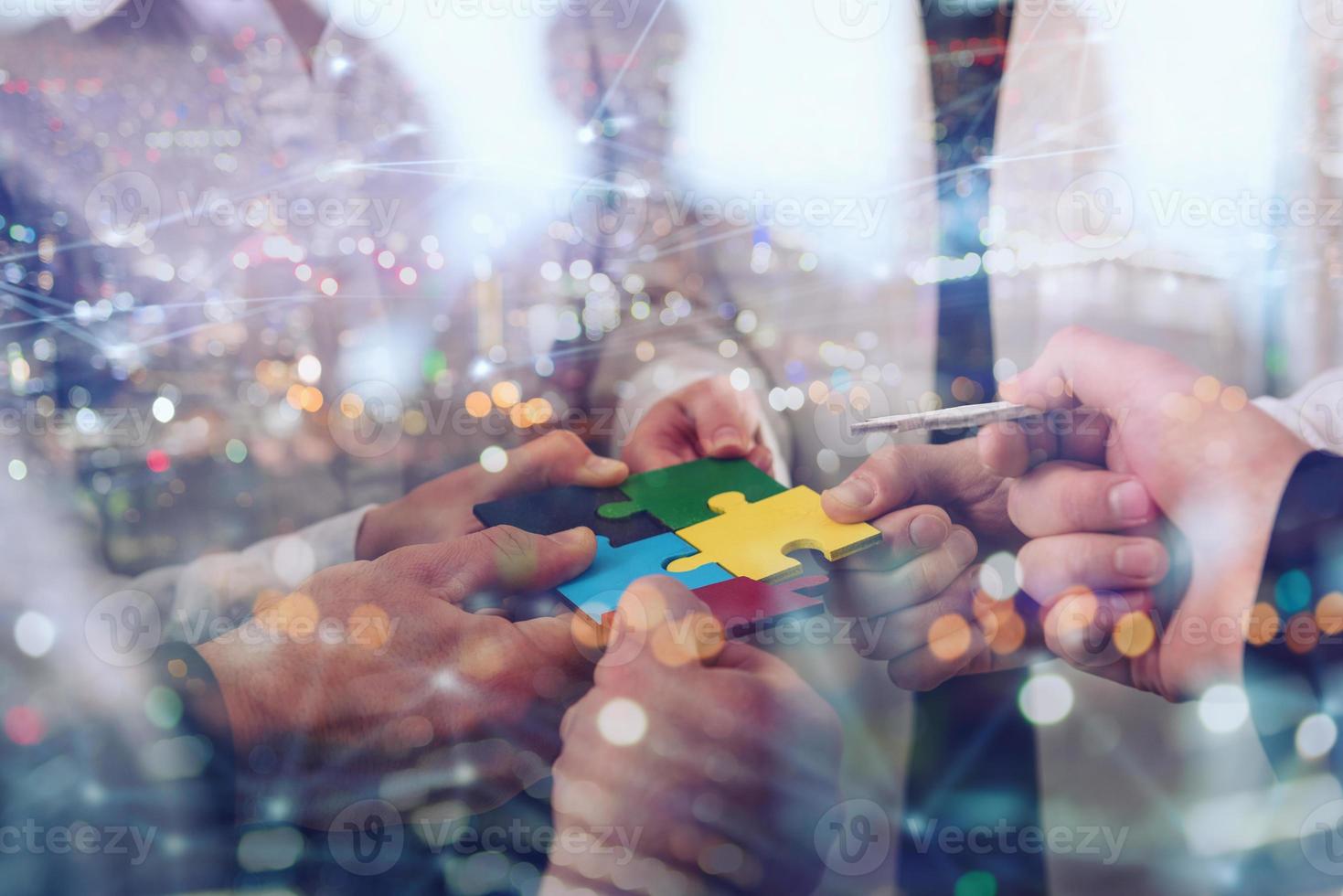 Teamwork of partners. Concept of integration and startup with puzzle pieces photo