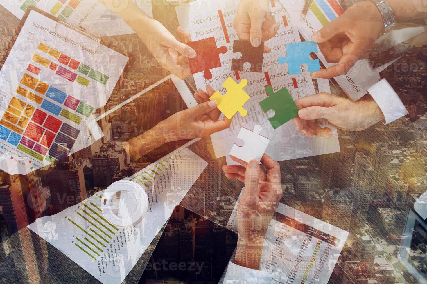 Teamwork of partners connect puzzle pieces as integration and startup photo