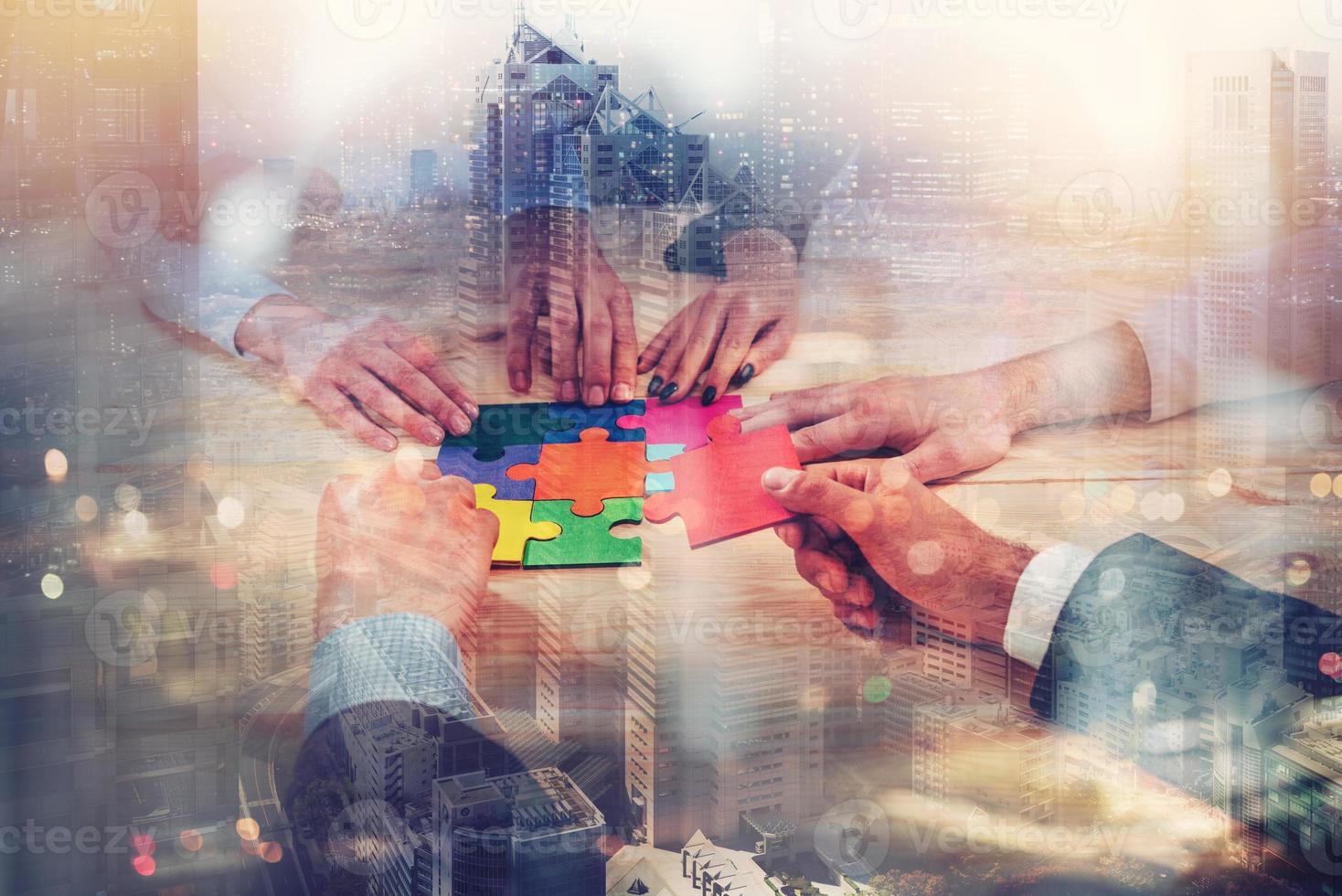 Teamwork of partners connect puzzle pieces as integration and startup photo