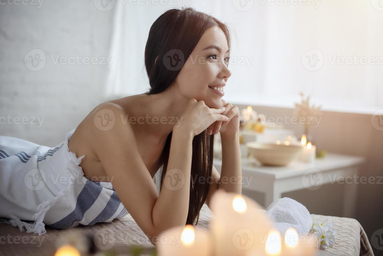 Woman relaxing with a massage in a spa center photo