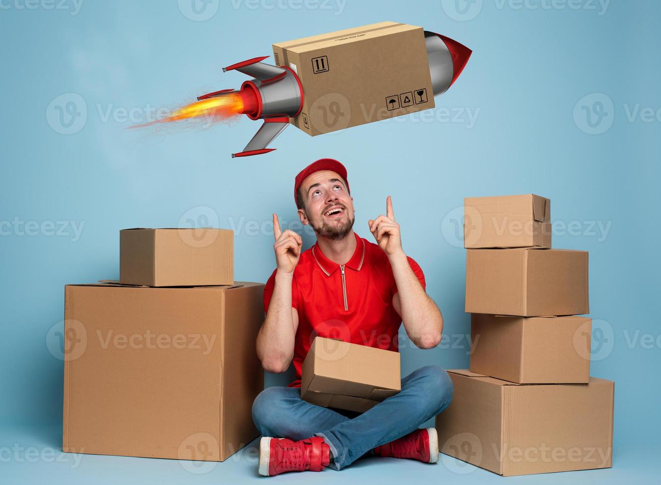Courier is happy because boxes are delivery fast like a rocket. Studio on cyan background photo
