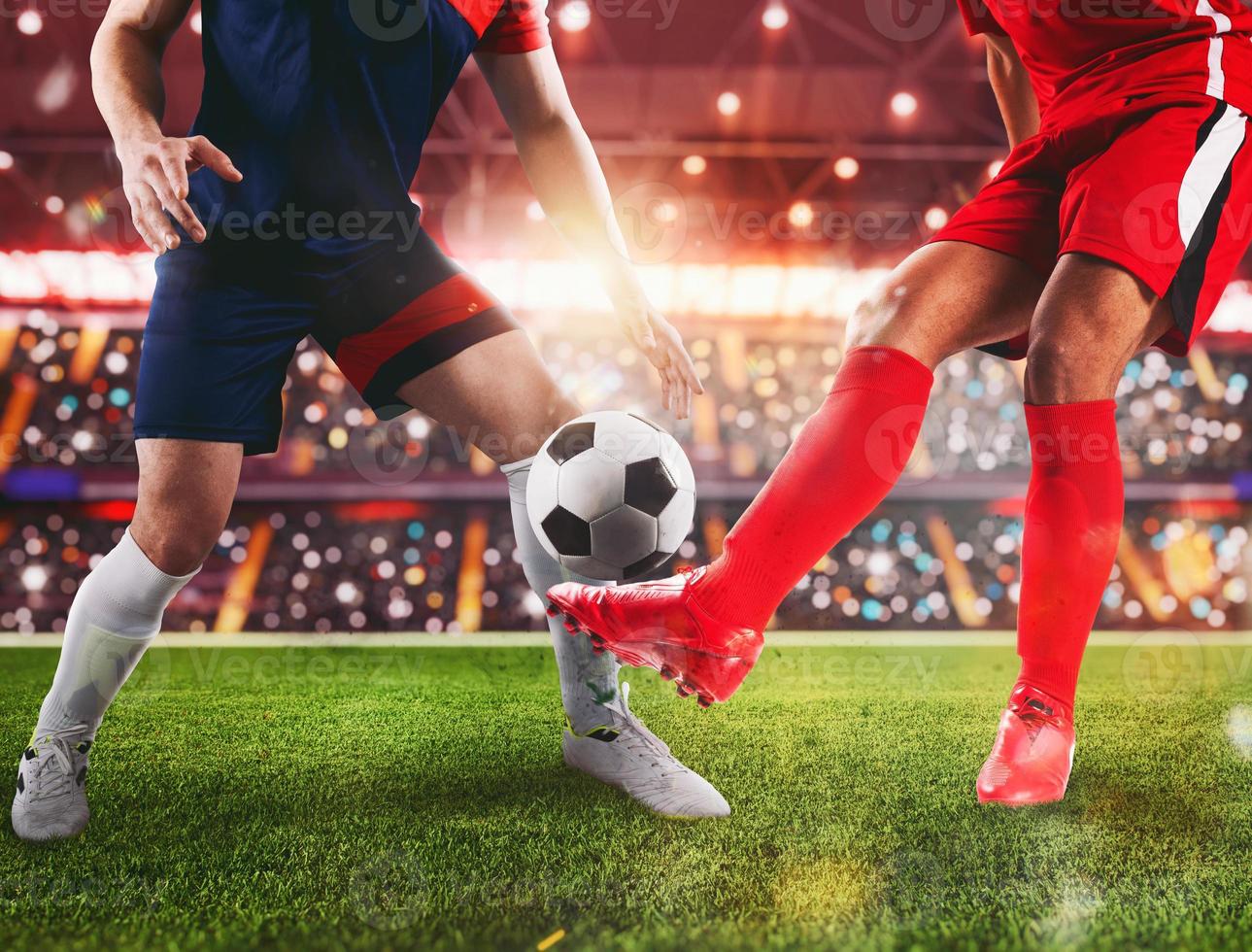 Soccer players fight for the soccerball at the stadium during the match photo