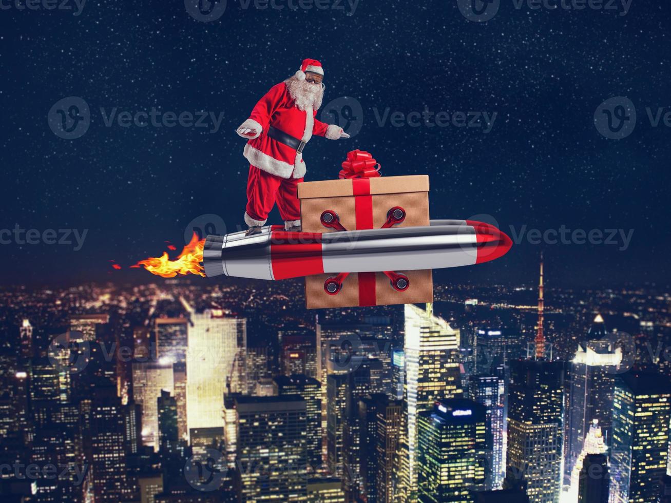 Santa claus delivers gifts with a fast space rocket photo