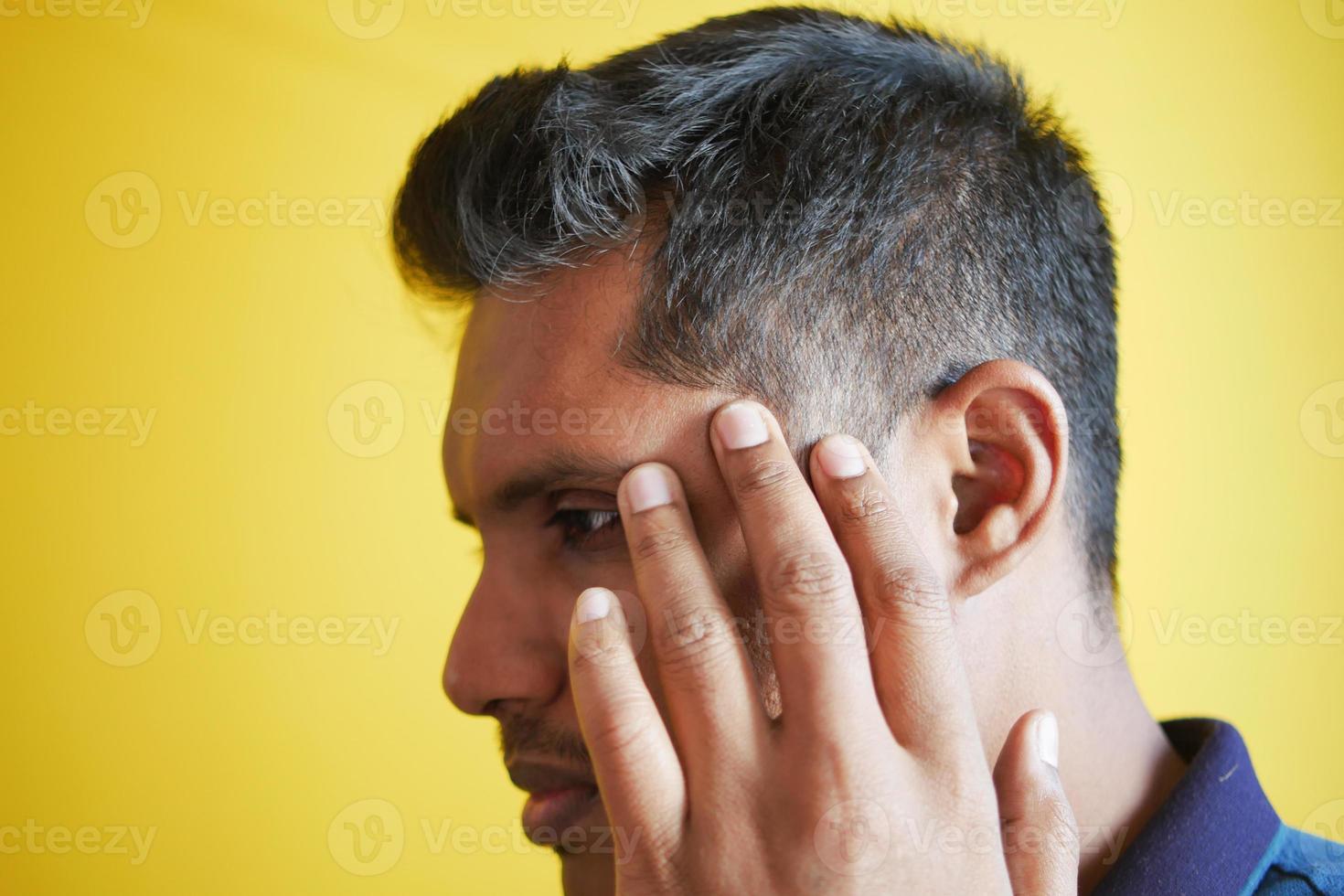 hair loss concept with man checking his hair photo