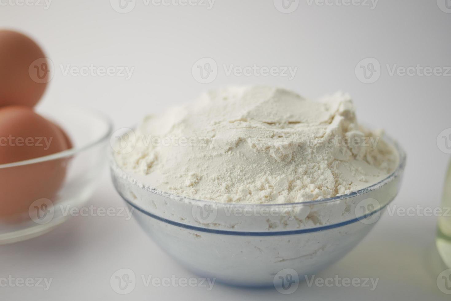 wheat flour in a bowl on table photo