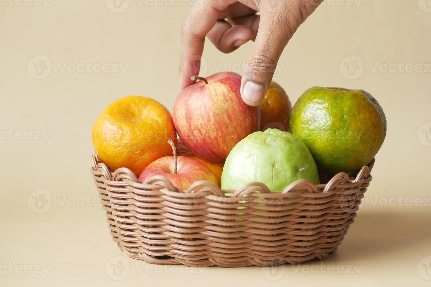 mixed fruits in a bowl on table photo