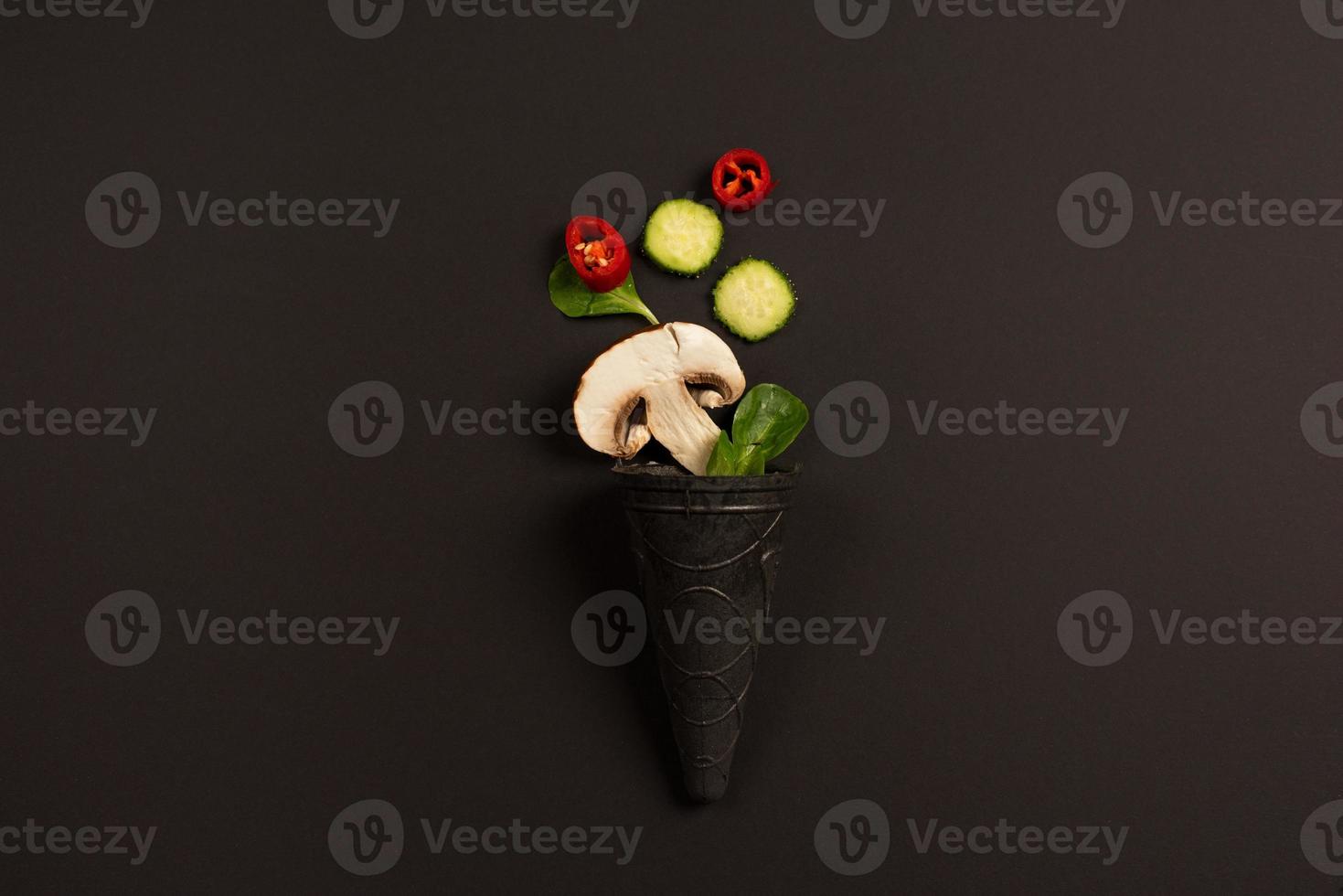 Modern composition concept with vegetable on dark background photo