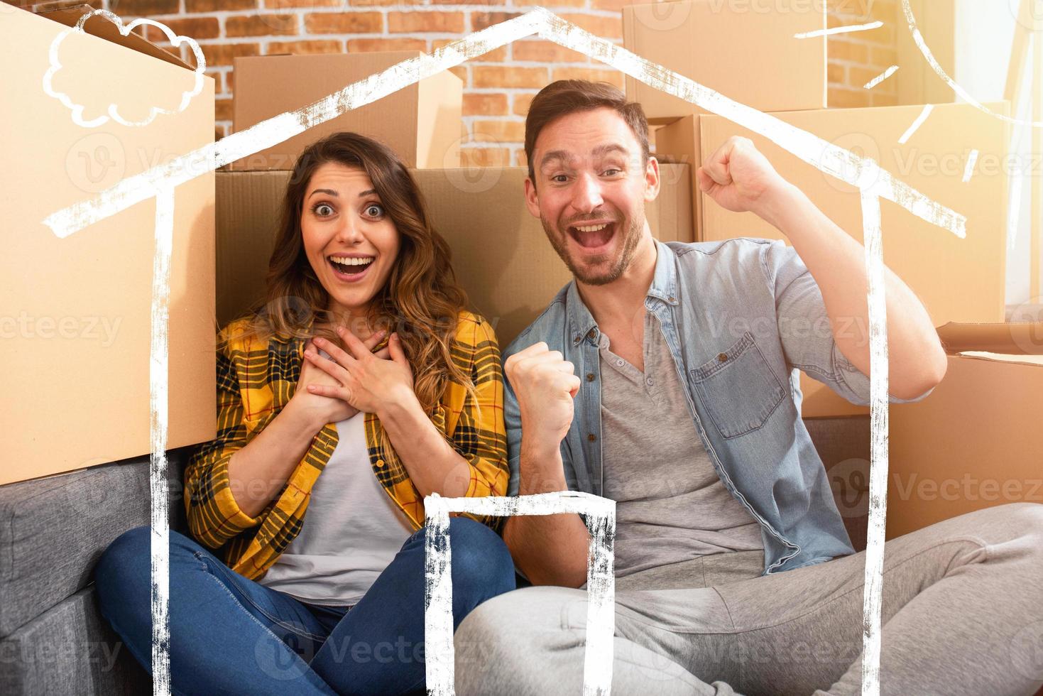 Happy couple have found a new home and they need to arrange all the packages. Concept of success, change, positivity and future photo
