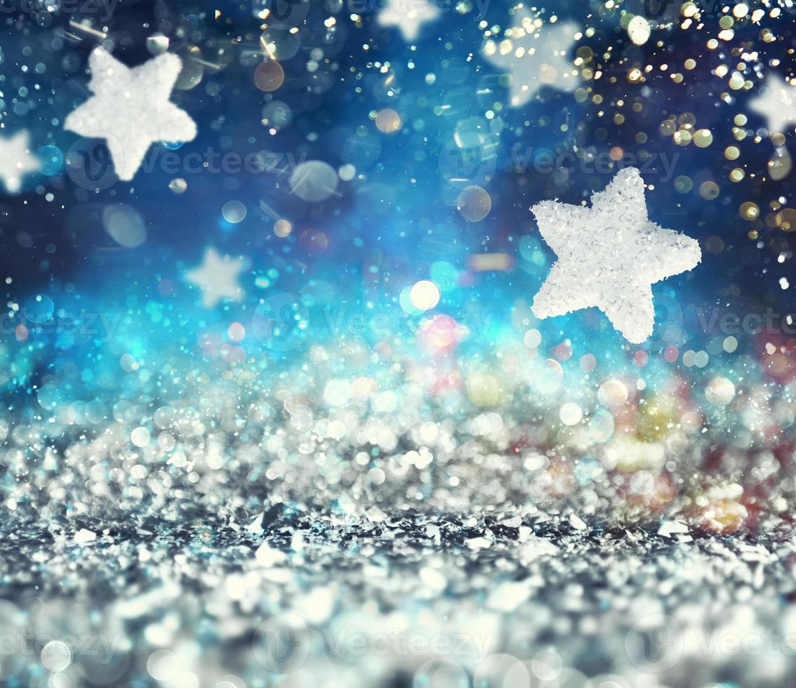 Abstract glowing Christmas blue background with stars photo