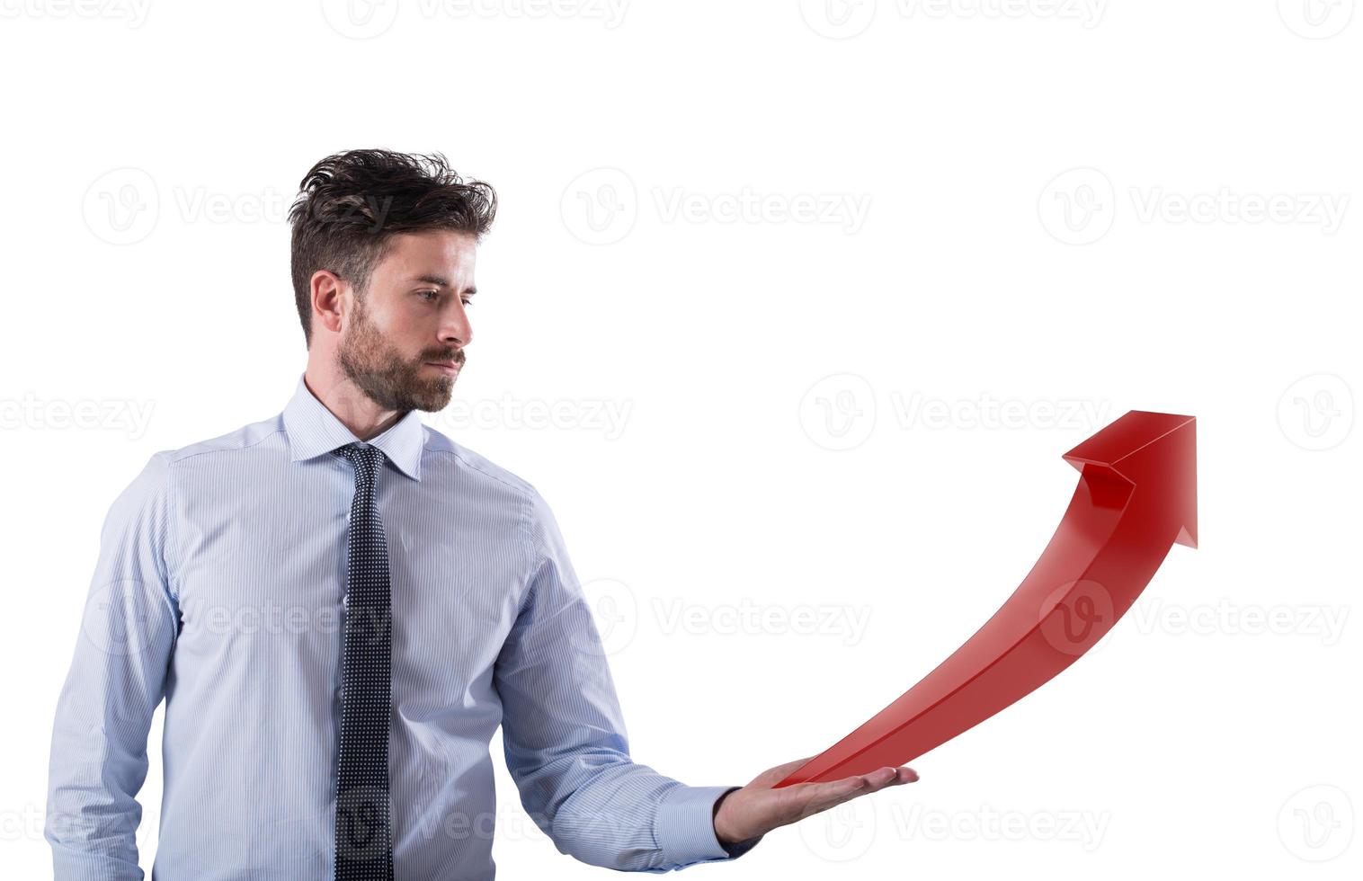 Businessman holds a growing statistic company photo