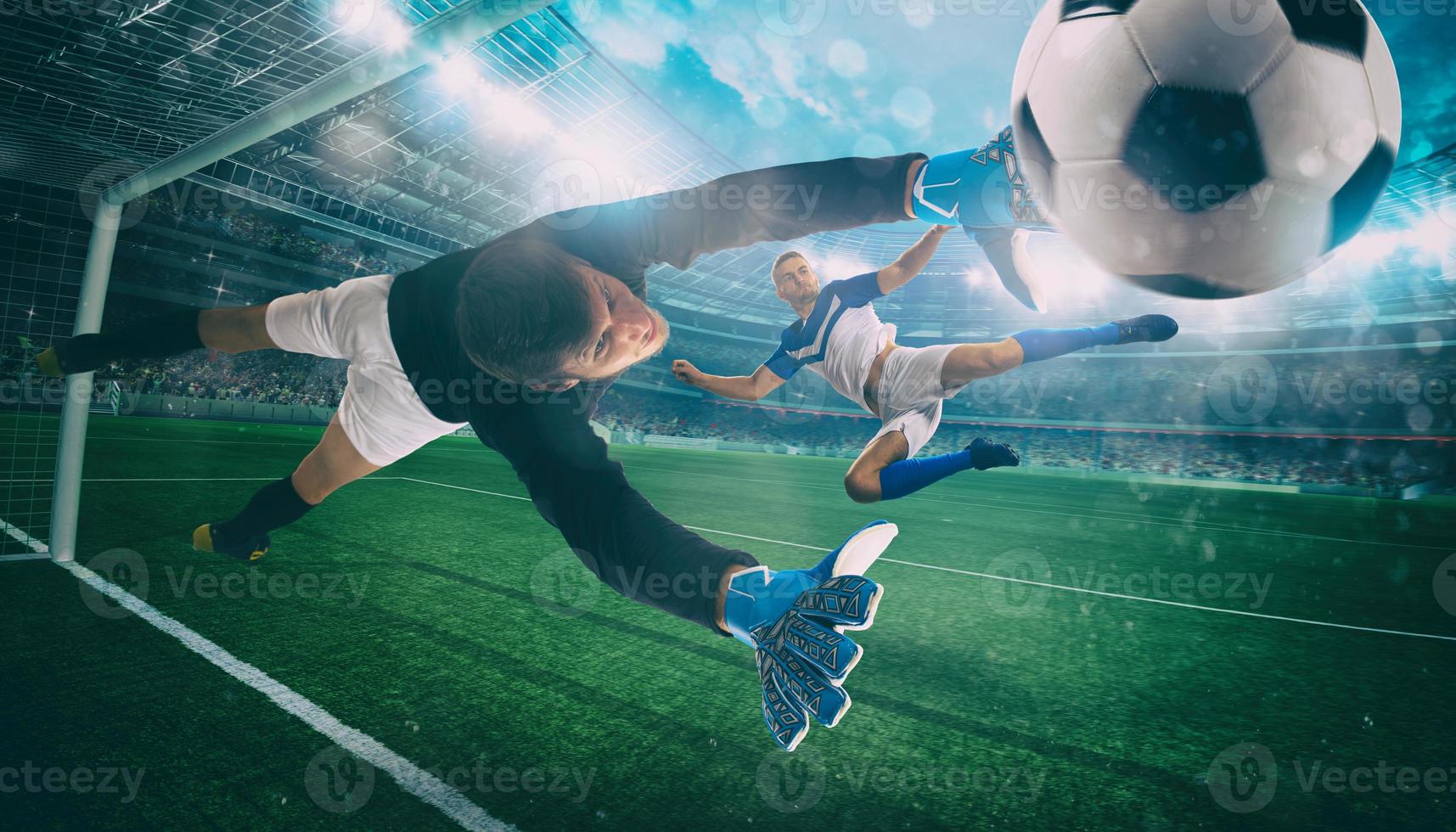 Goalkeeper catches the ball in the stadium during a football game photo