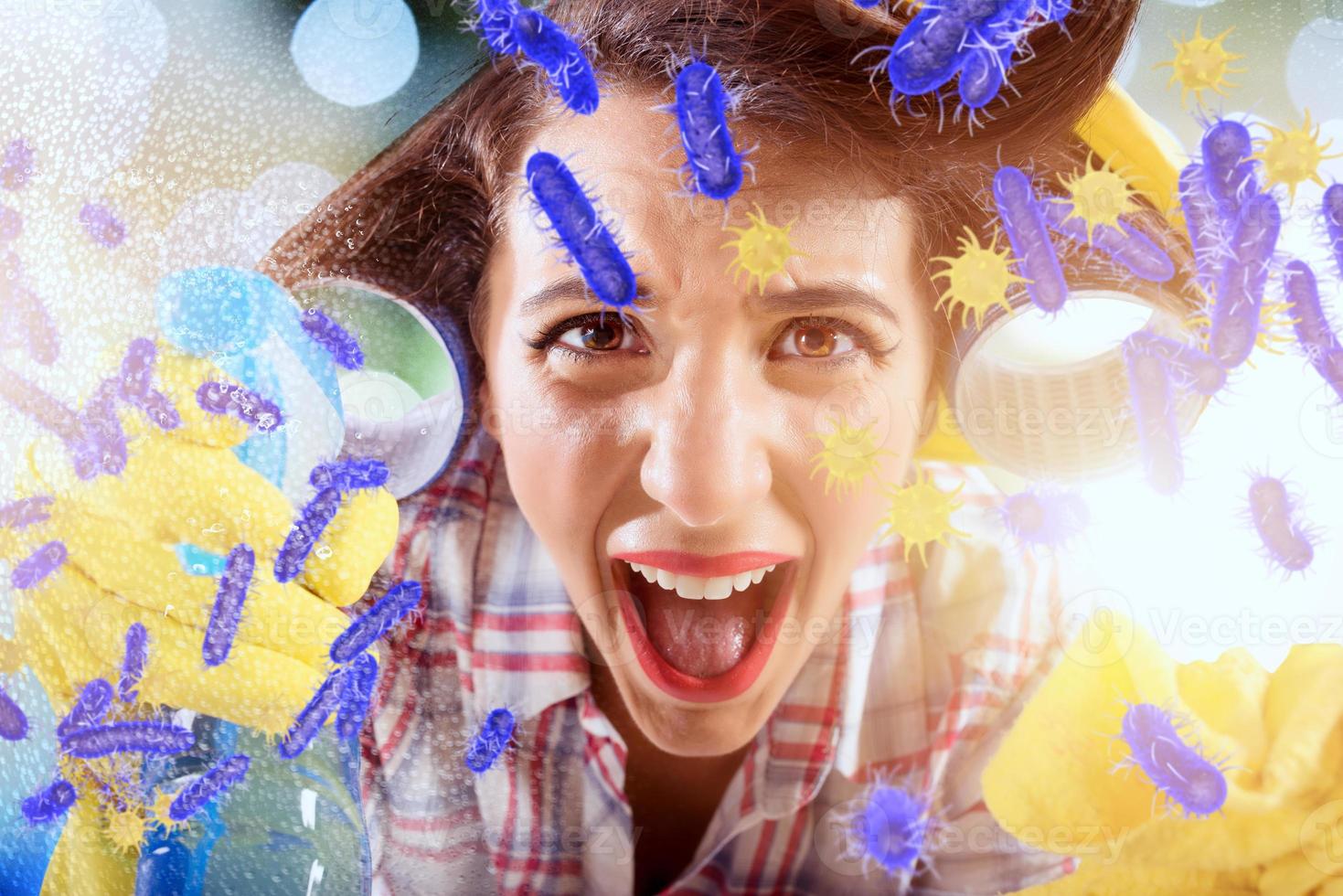 Funny housewife cleans and disinfects to keep germs, viruses and bacteria away. photo