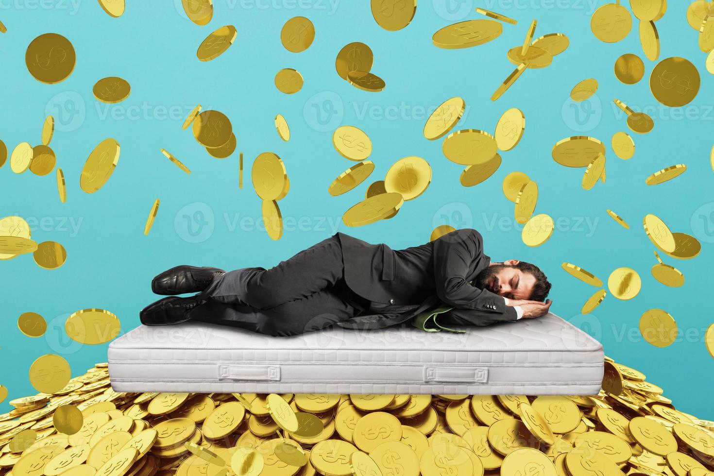 Businessman sleeps serene over a pile of golden coins. concept of wealth and good investment photo