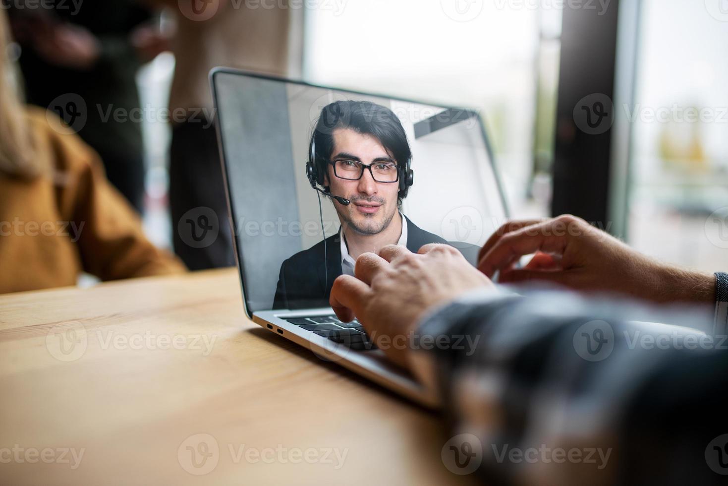 Businessman is working in remote with a videocall due to quarantine of coronavirus covid19. Concept of smart working photo