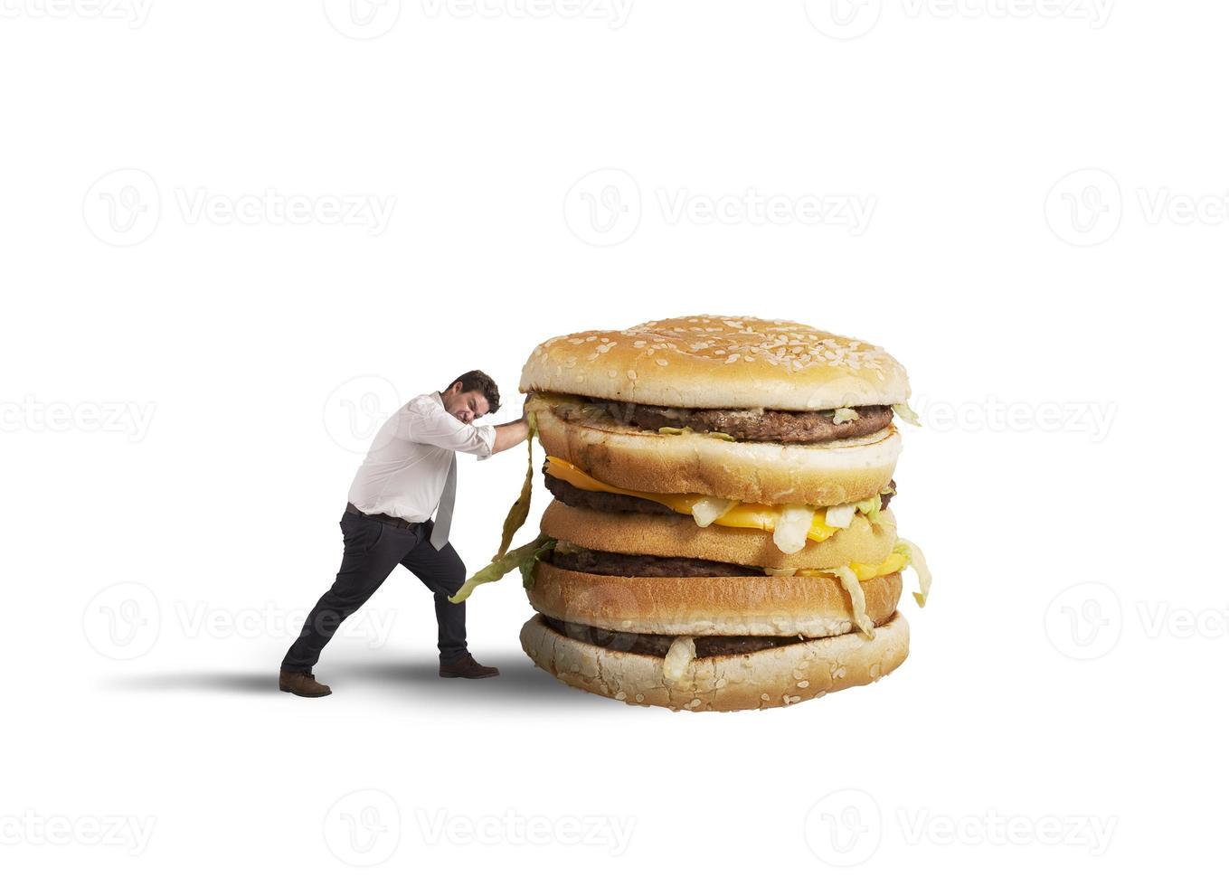 Man pushes a sandwich photo