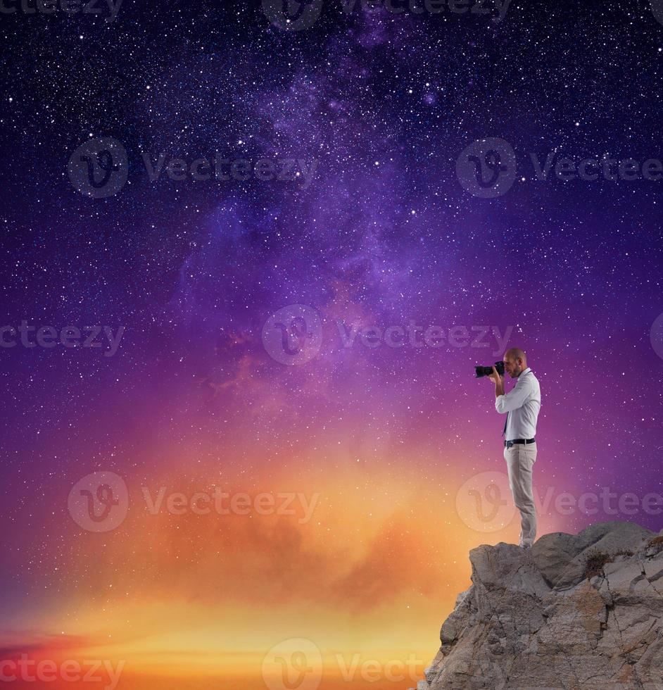 Photographer take a photo in a night sky full of stars