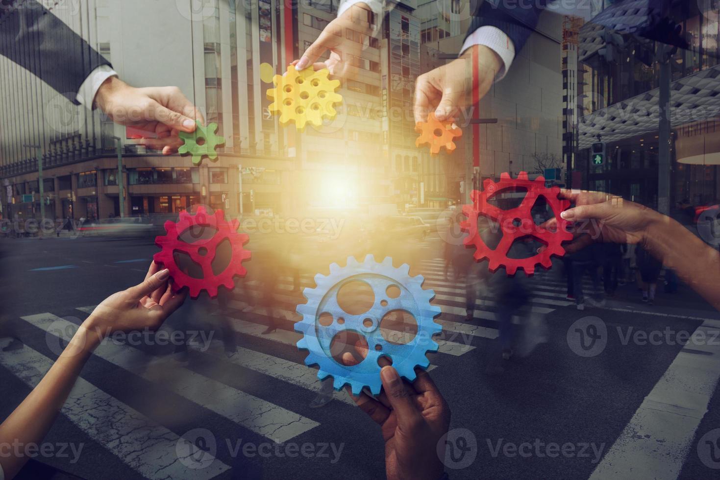 Business team connect pieces of gears. Teamwork, partnership and integration concept. Double exposure photo