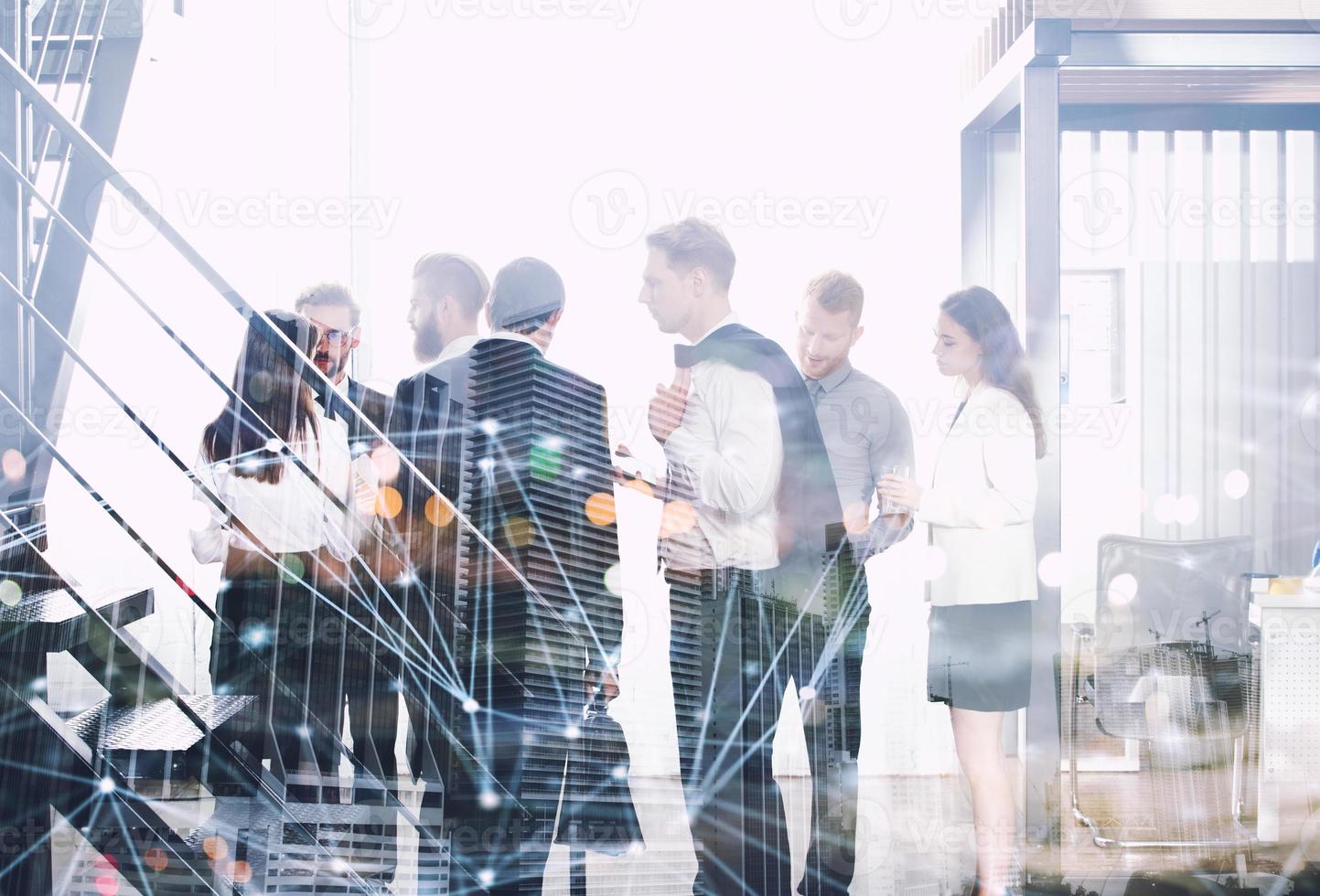 Business people work together in office with internet network effects. Concept of teamwork and partnership. double exposure photo