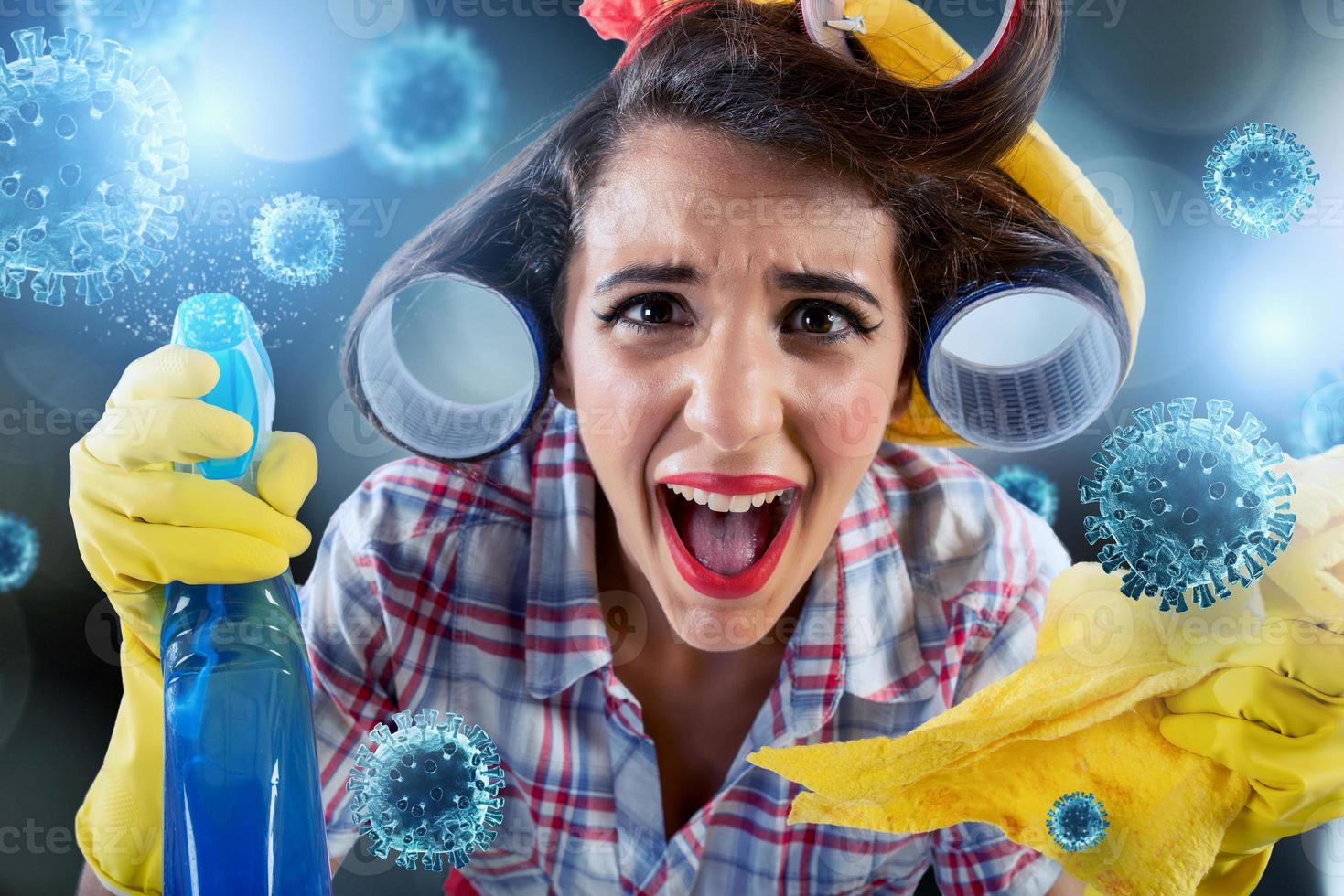 Funny housewife cleans and disinfects to keep germs, viruses and bacteria away. photo