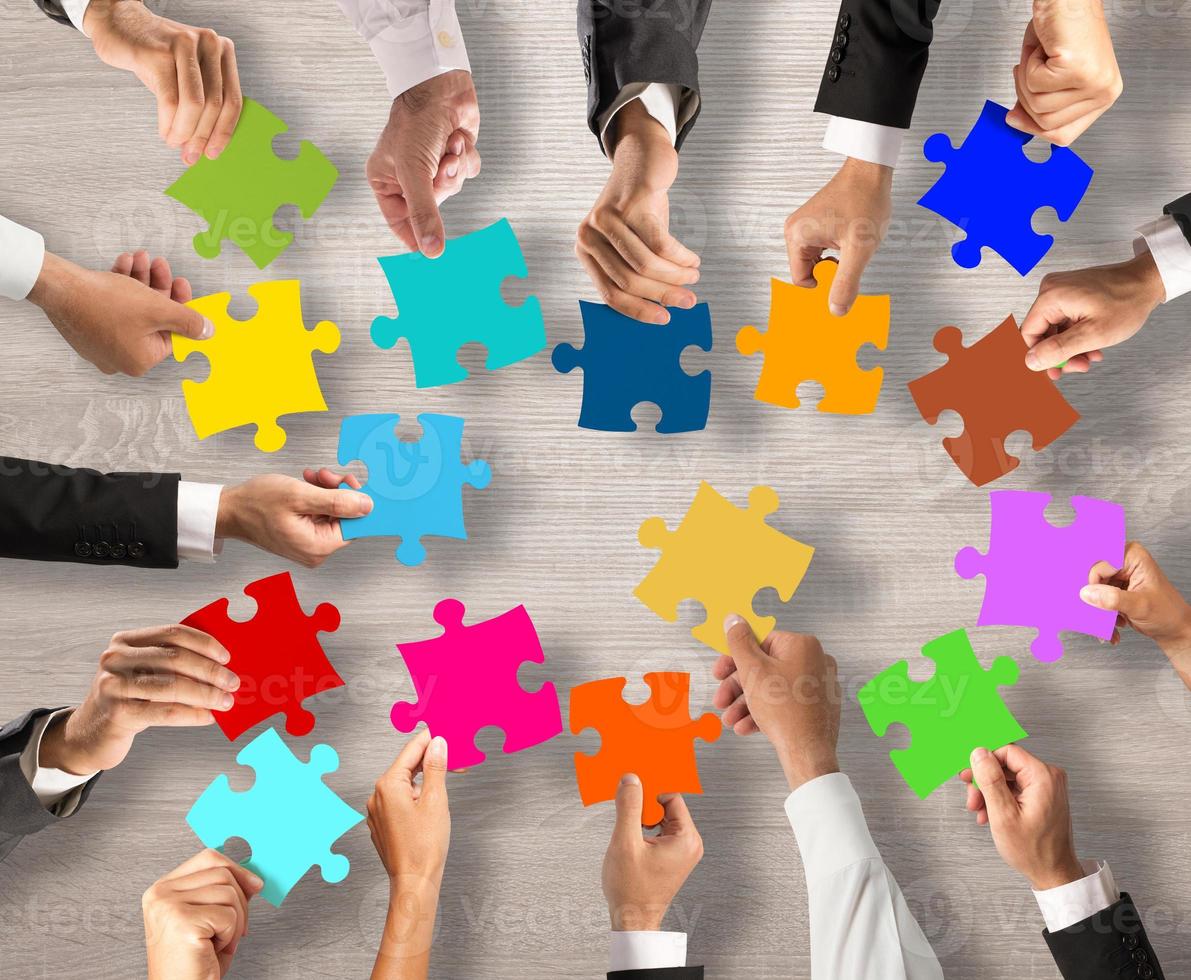 Teamwork and integration concept with puzzle pieces photo