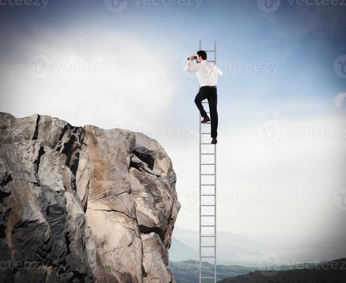 Manager looks far for new business. Concept of new opportunities photo