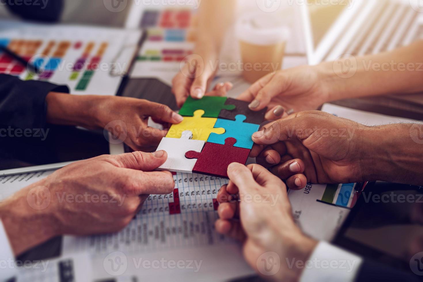 Teamwork of partners. Concept of integration and startup with puzzle pieces photo
